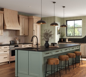 Modern kitchen with a dark gray island, light-colored cabinetry, and a chevron backsplash. Image for the Classic Collection.