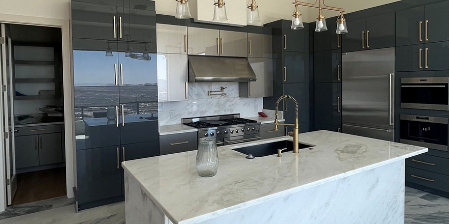 Bright kitchen with white cabinetry, a stainless steel refrigerator, and a coffee station beside the microwave.
